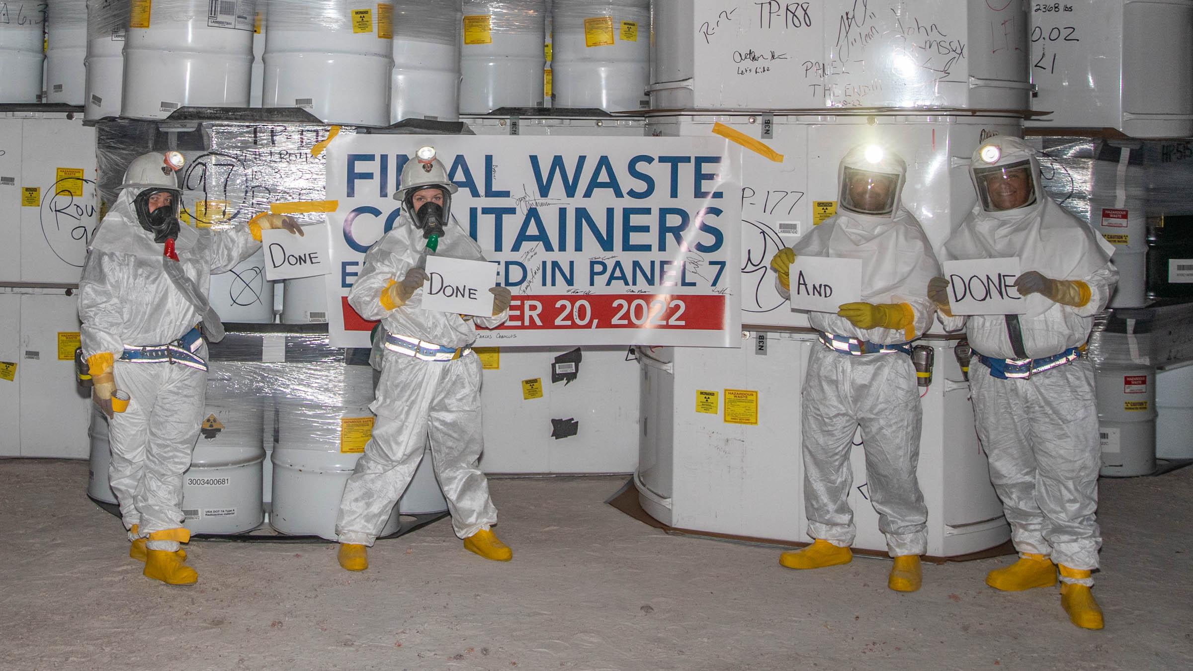 WIPP employees posing with the last waste containers in panel 7 room 1